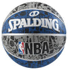 A Spalding Graffiti Rubber Basketball featuring a vibrant graffiti-inspired design in grey, blue, and black tones with the brand logo and NBA branding visible.
